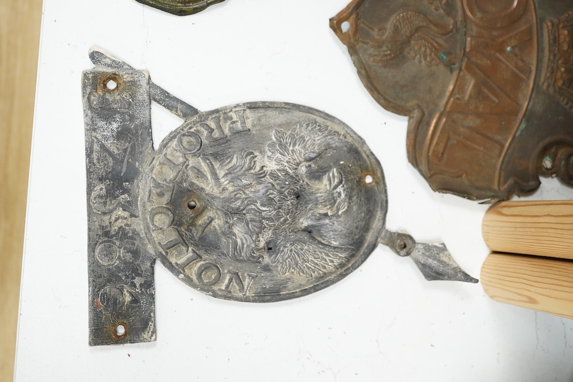A collection of plaques to include a lead example and two copper examples one ‘Fire & Life, Farmers’, largest 30cm high